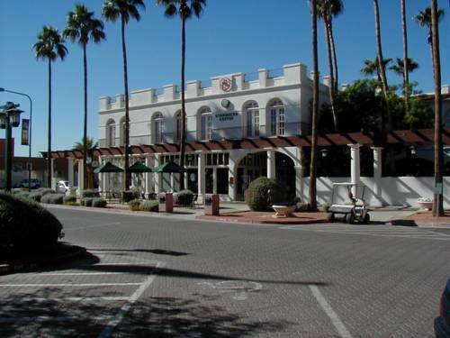 Nearby building with palms